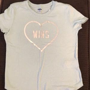 Girls light blue shirt sleeve T-shirt.